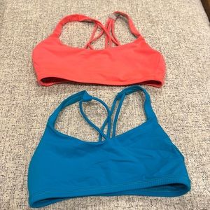 Two lululemon sports bras. Turquoise and neon orange.